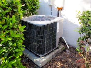 Air conditioning unit on the site of a house