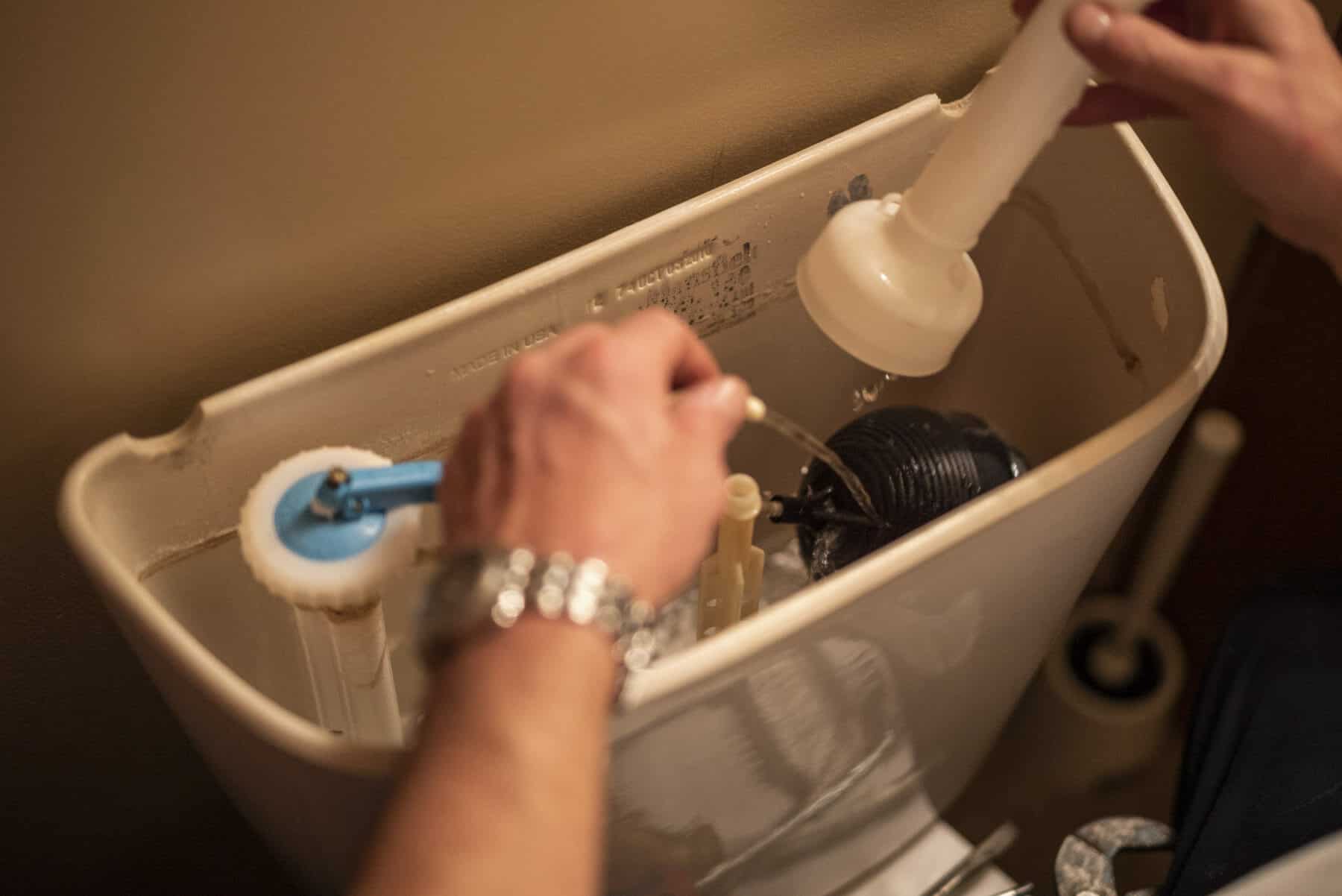 Plumber repairs toilet for Utah homeowner