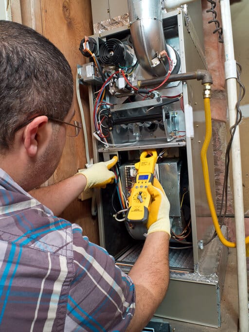 handyman repairman conducting residential HVAC and furnace repair