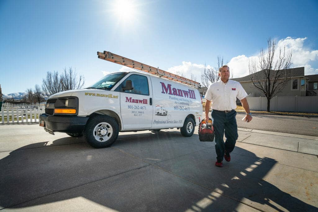 Manwill plumbing technician on his way to fix a steam humidifier